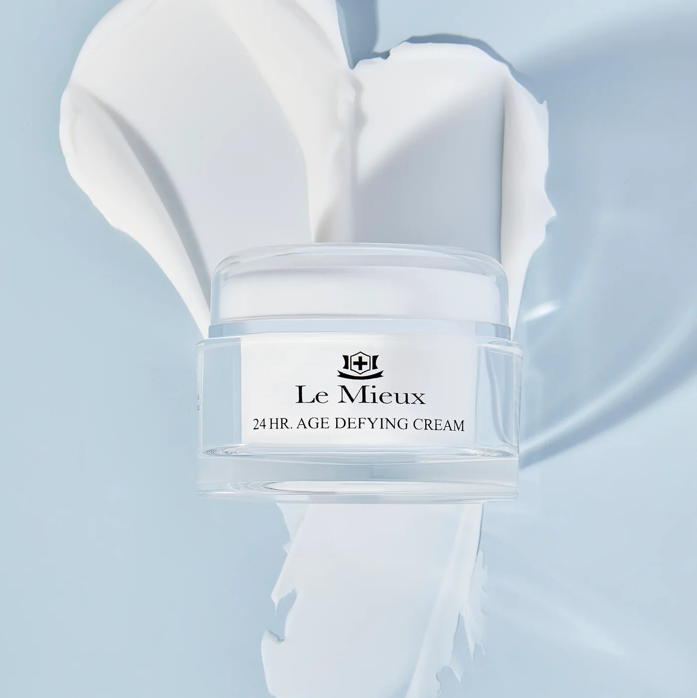 Model applying Le Mieux 24 Hr. Age Defying Cream to moisturize and reduce fine lines for younger-looking skin.